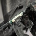 Третий погребен под слоем черного скотча на обратной стороне монитора.
